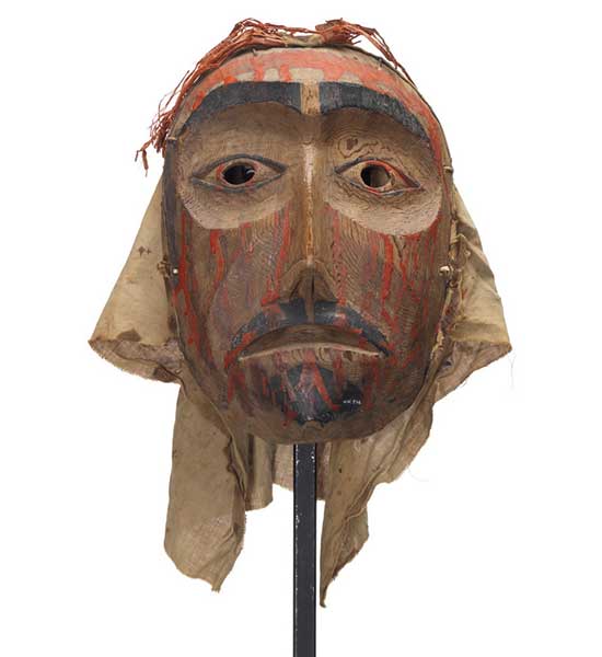 Mourning mask with red paint drips representing blood on forehead, cheeks and chin. Black painted goatee, lips and eyebrows.