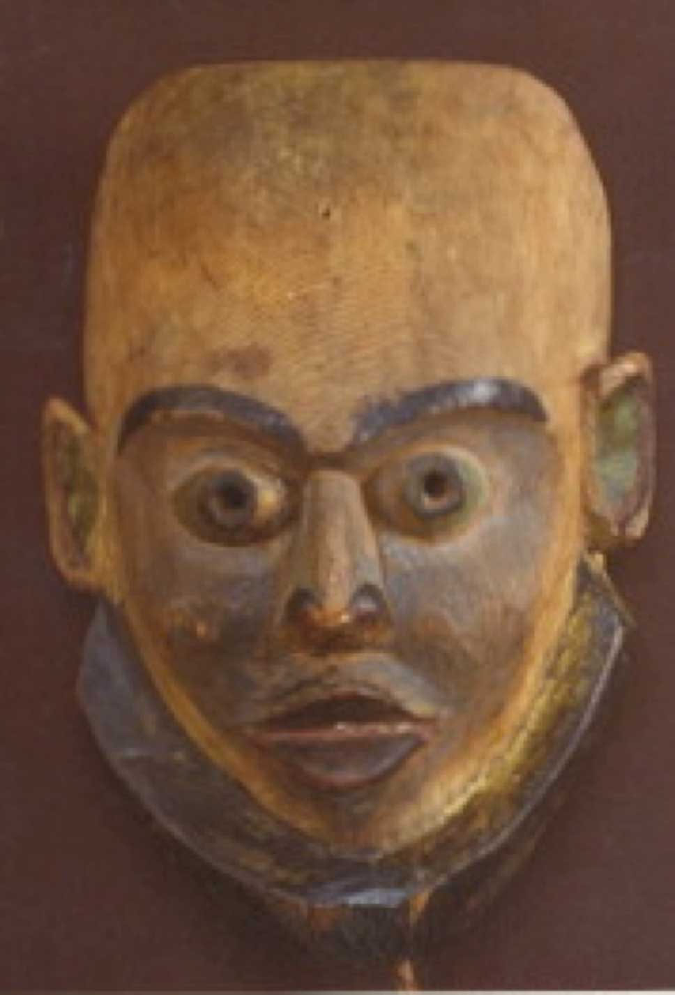 Photographie couleur alternative du masque de Lutins, Gangananamis, prise sur un fond noir