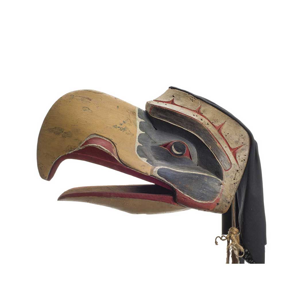 Kwigwis or eagle mask, yellow beak, green patches around eyes, red below beak and behind eyes, feather and cotton head covering.