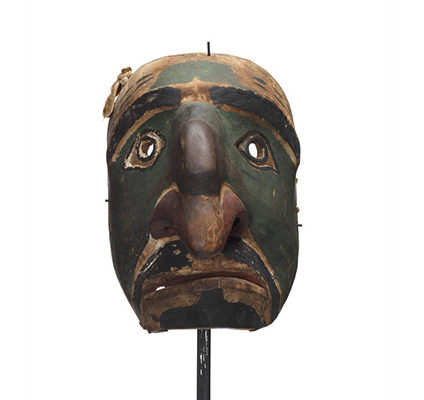 A Nułamał or fool dancer exaggerated nose with additional projection near bridge; large nostrils painted red; moustache and goatee painted black.