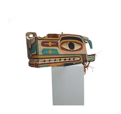 Haietlik or sea serpent mask, painted with geometric designs in a wide range of colours.