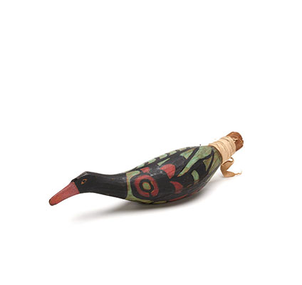 A Yadan or rattle in the shape of a bird, one of a group, carved in cedar, black with green and red markings