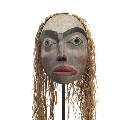 Forest spirit mask, feminine appearance, red lips and trim surrounding nostrils, rosy cheeks and long cedar bark trim.