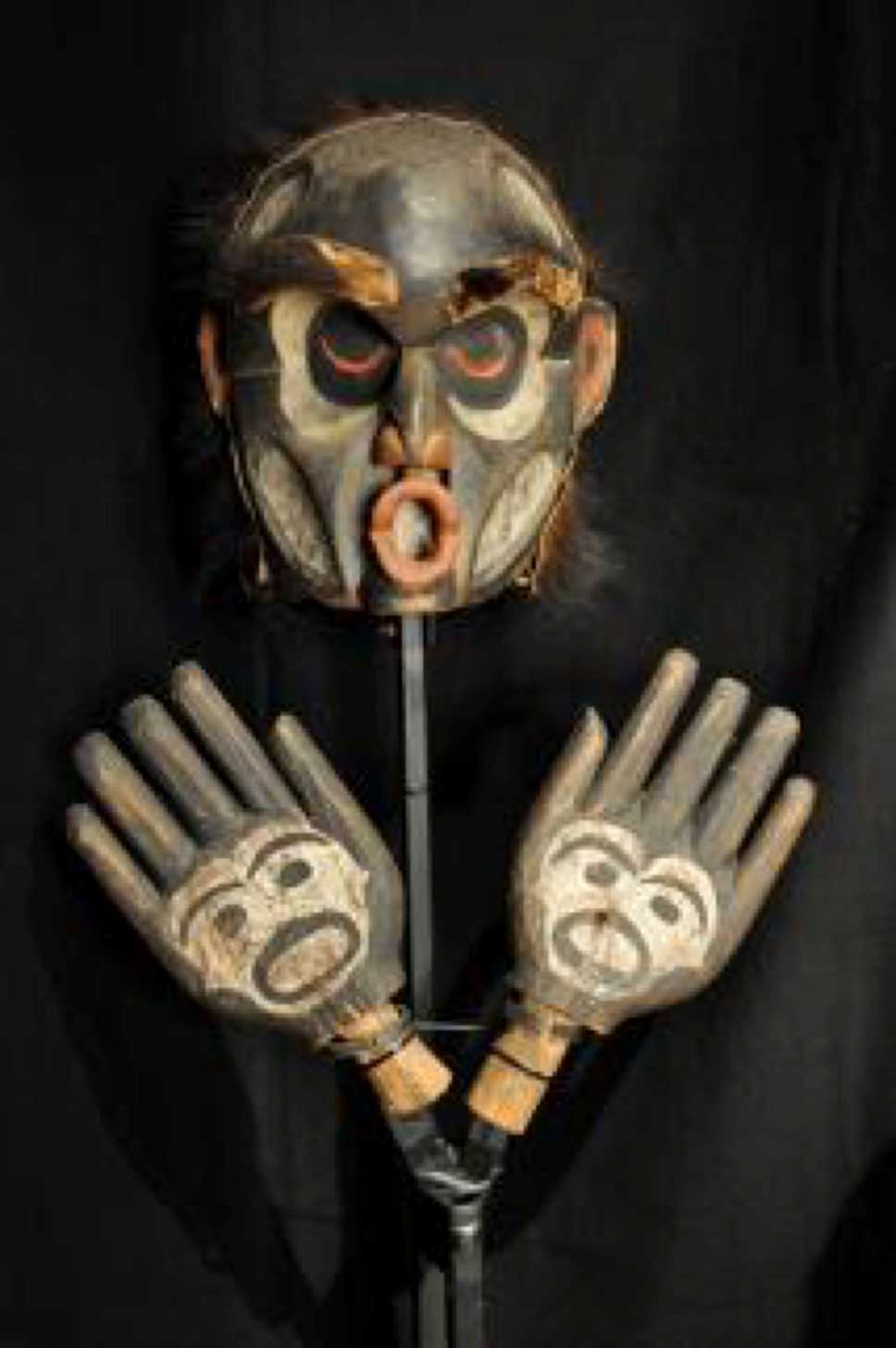 Colour photograph of Dzunukwa - Giant of The Woods mask shot against a black background