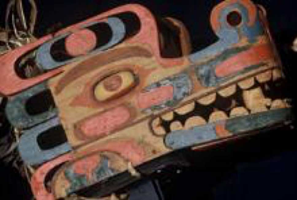 Colour photograph of Haietlik Sea Serpents mask side view shot against a black background