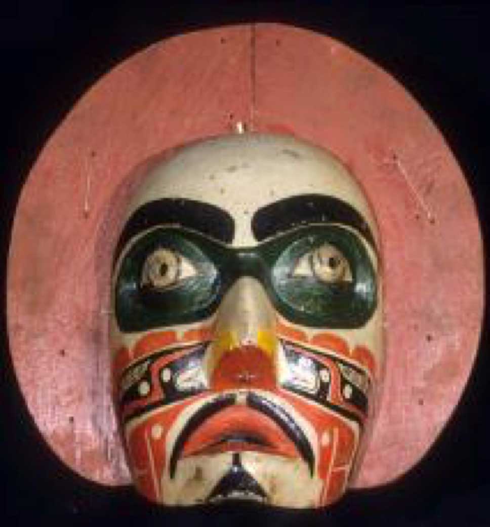 Alternate colour photograph front view of ’Makwala - Moon mask shot against black background