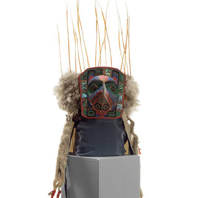 Yaxwiwe' frontlet with brightly painted hawk face surrounded by abalone inlays, sea lion whiskers, cotton and ermine train.