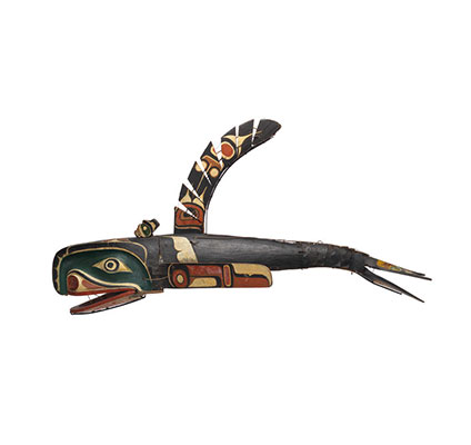A large whale mask, black green and white painted markings with articulating mouth, fins and tail.