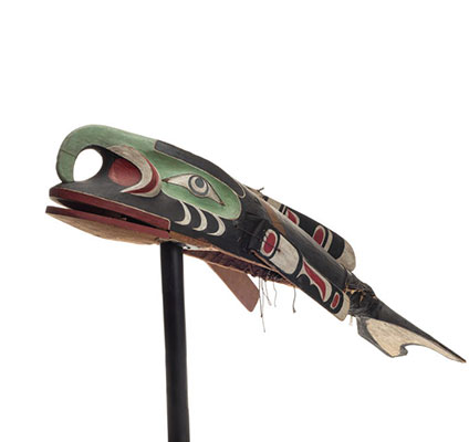 A large Maxinuxw or killer whale mask, numerous hinged parts, dorsal fins, flipper and tail, black red and white markings, pale green beak which projects over the upper jaw.