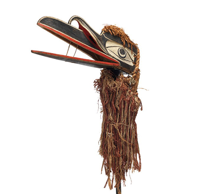A mystical raven mask with long hinged beak, black, white and red painted markings with braided cedar back, top and below.