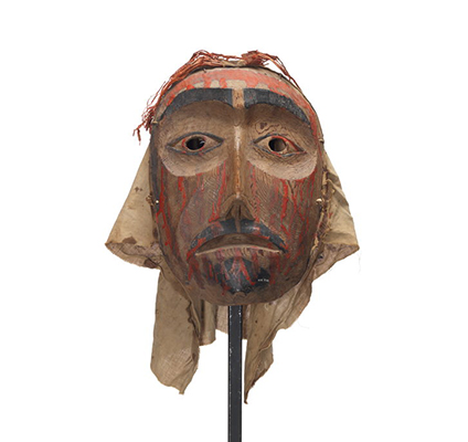 Mourning mask with red paint drips representing blood on forehead, cheeks and chin. Black painted goatee, lips and eyebrows.