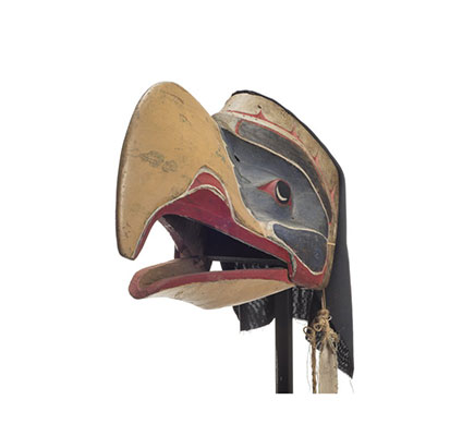 Kwigwis or eagle mask, yellow beak, green patches around eyes, red below beak and behind eyes, feather and cotton head covering.
