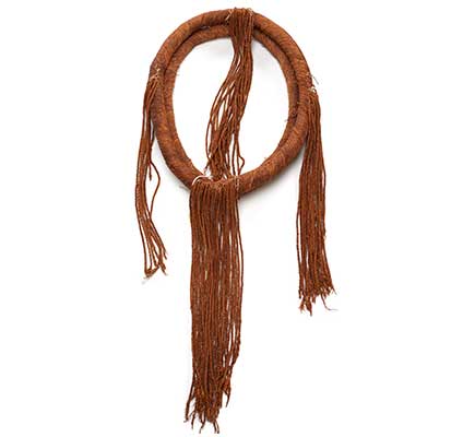 Tłagakwaxawa'yi or neck ring, woven and twisted circular band of red cedar bark with tassels attached in four bundles.