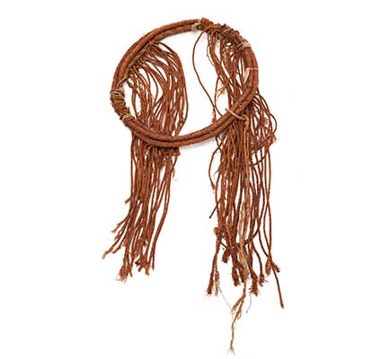 Tłagakwaxawa'yi cedar bark neck ring with long braided tassels part of Hamaťsa regalia.
